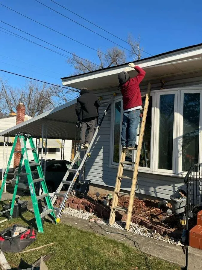 Restoration crew performing exterior repair in Lawrence